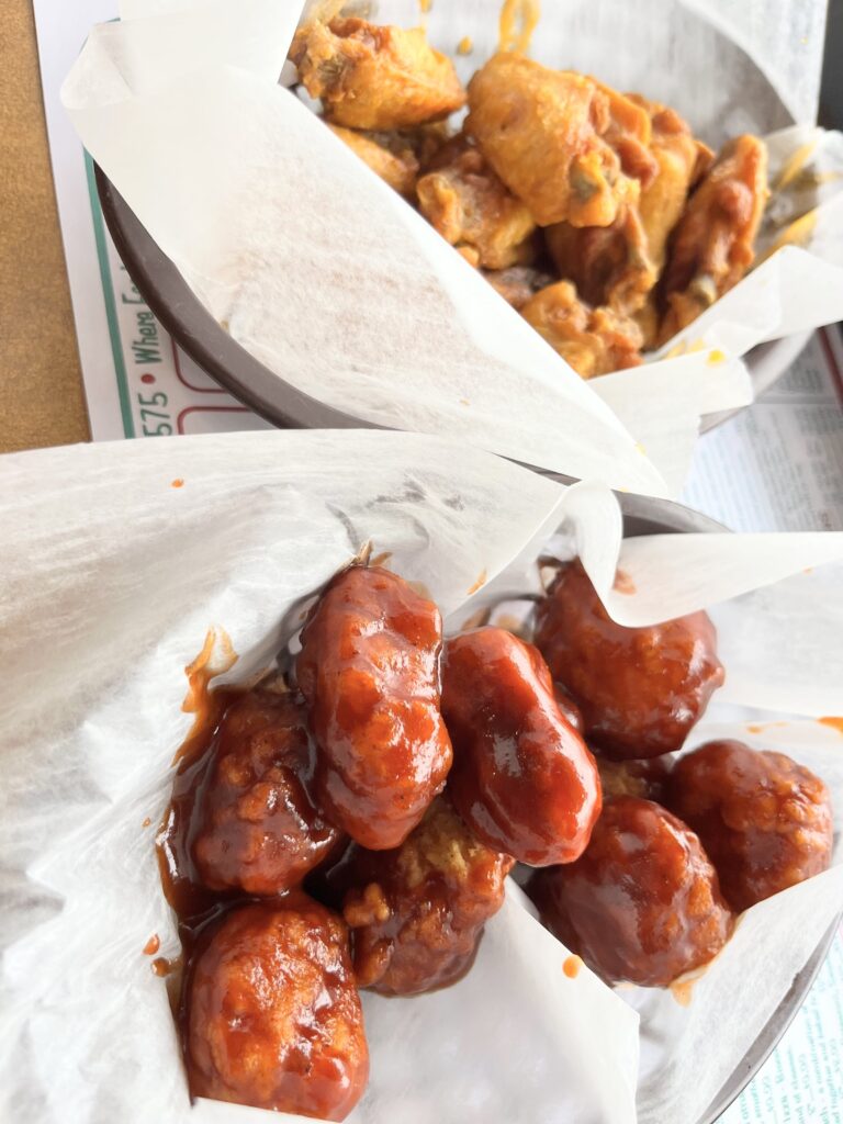 Basket of boneless wings tossed in barbecue sauce.